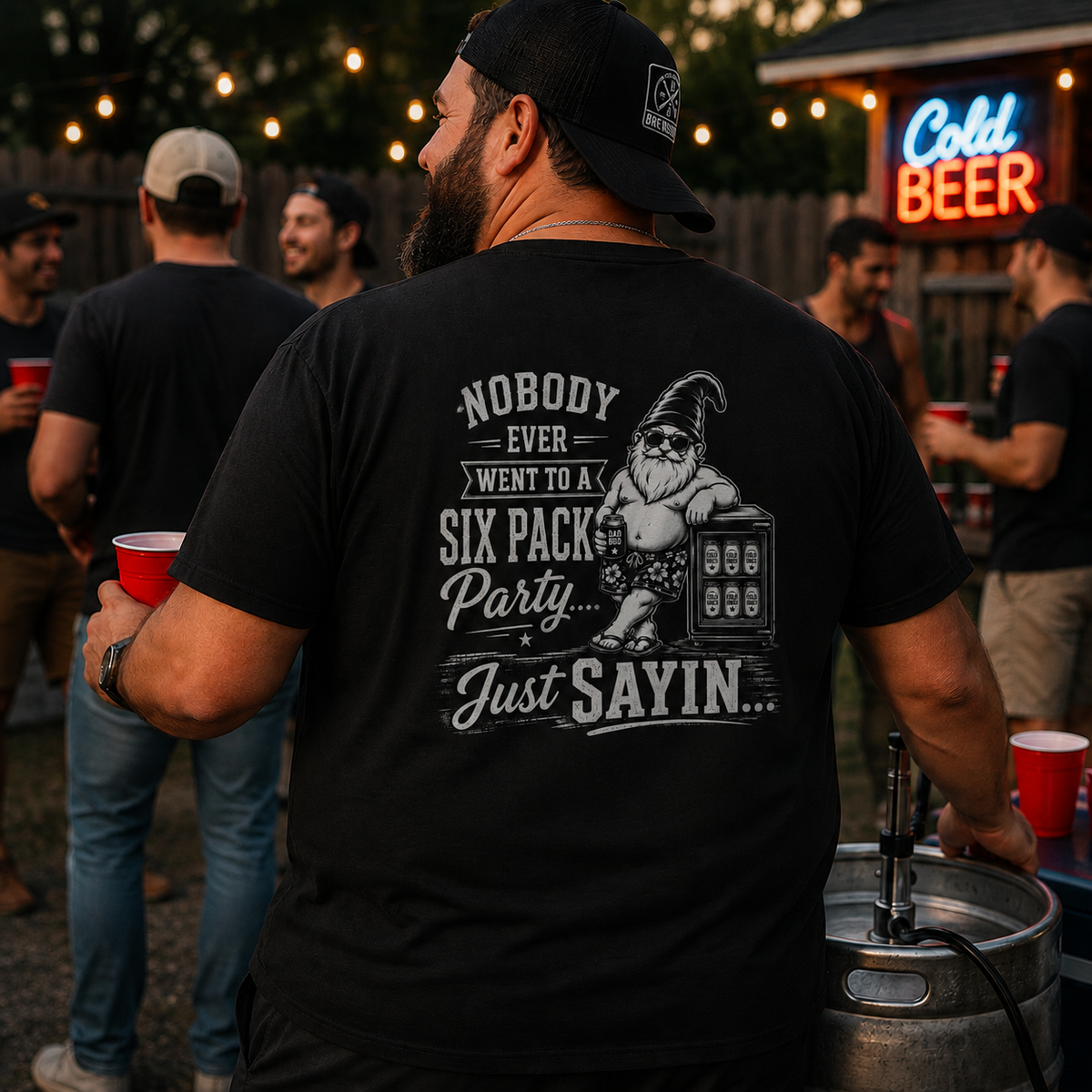 Man wearing Nobody Ever Went to a Six Pack Party Bodrick T-shirt at a backyard cookout